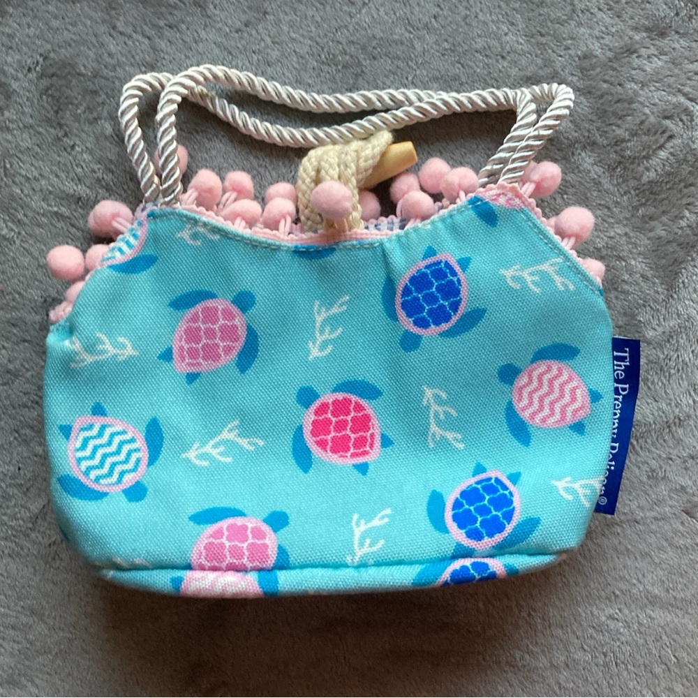 The Preppy Pelican Child's Bag by The Petting Zoo with Turtle Print & Pom Poms